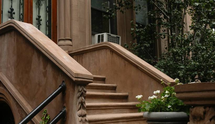 Brownstone row houses, shown in sepia